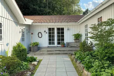 Image de Idyllically situated wooden house by.