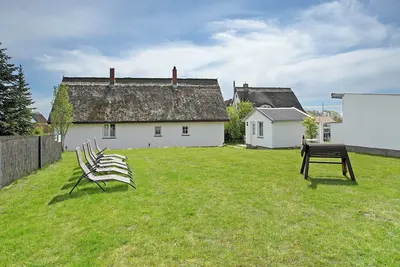 Image de Appartement de vacances 'Reetferienhaus Lütt' avec terrasse partagée et Wi-Fi