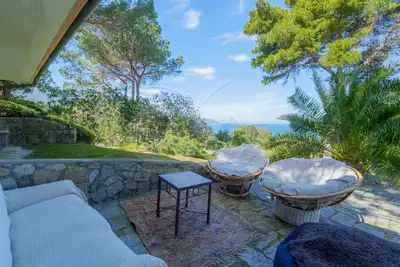 Villa Il Cappero immersed in the greenery of well-kept gardens with an incredible view of the Gulf,