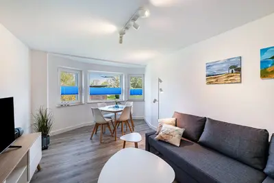 Image de Strandnahe Ferienwohnung 1\" avec terrasse privée, jardin privé et Wi-Fi.