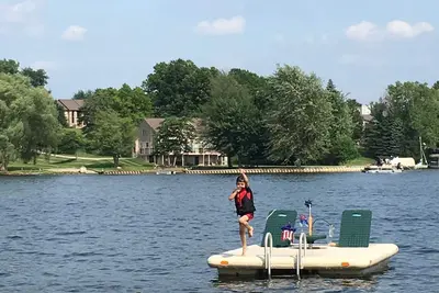 Image de Lake Front Cottage on Woodland Lake with private beach, boat and jet ski docks.