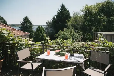 Image de Turmvilla upper floor: balcony, wood-burning stove and water access