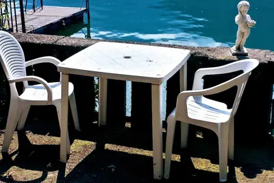 Apartment in villa Le Palme directly on the lake of Lugano
