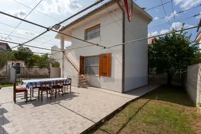 Image de Appartement de vacances \"Casa Con Giardino\" avec vue sur les montagnes et terrasse partagée