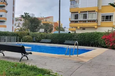 Image de Appartement 'Torre Del Mar' avec piscine partagée, jardin partagé et climatisation
