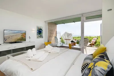 Image de Modern apartment with terrace, unique sea view and Wlan. Pets allowed.