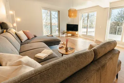 Image de The vacation apartment with large roof terrace is located in the forest on Ratzeburger Küchensee