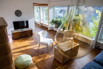 Image de Appartement haut de gamme avec terrasse et grand jardin, parking gratuit, SmartTV, etc.