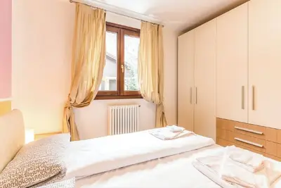 Image de Appartement 'Rosa delle Dolomiti Bilocale1' avec vue sur les montagnes et sauna partagé