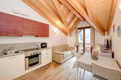 Image de Appartement 'Rosa delle Dolomiti Bilocale3' avec vue sur les montagnes et sauna partagé
