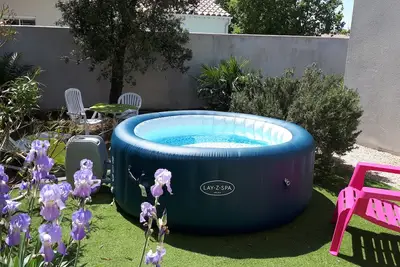 Image de Mignon appartement, avec Jacuzzi et Jardin privés