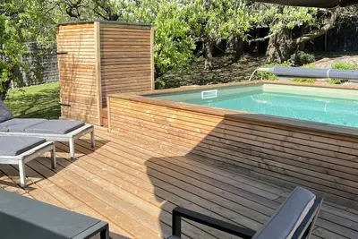 Image de Dans un écrin de verdure ma maison bois avec sa piscine privée