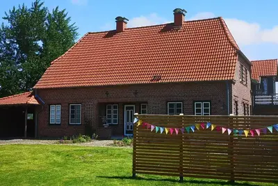 Image de Wunderschöne Ferienwohnung mit Kamin und Großem Garten an der Nordsee
