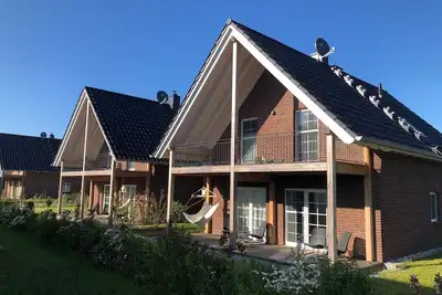 Image de Maison de vacances \"Ferienhaus Familienkoje Hannah\" avec terrasse privée, sauna privé et Wi-Fi