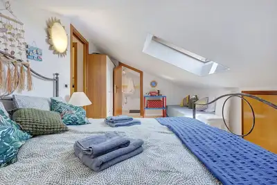 Image de Appartement de vacances \"Mansarda Di Ponente\" près de la plage avec jardin partagé et climatisation
