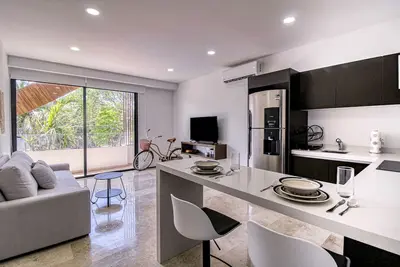 Caribbean condo in a great location with two pools, roof deck, gym, & balcony