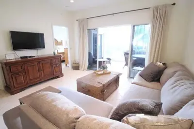Ground floor condo w/ screened porch - steps from the ocean