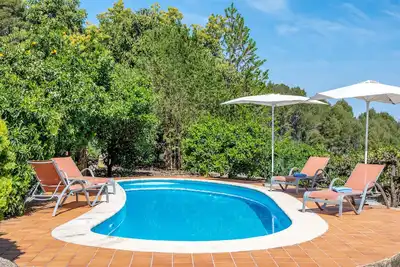 Image de Maison de vacances 'Can Jaumins' avec vue sur les montagnes, piscine partagée et Wi-Fi