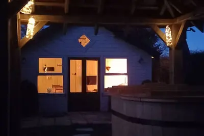 Image de Secluded timber cabin with private garden and wood fired hot tub.