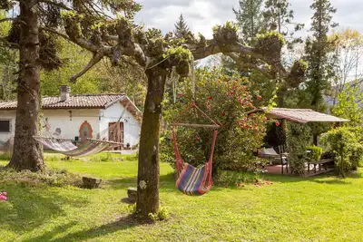 Image de Maison de vacances 'La Capannina' avec vue sur les montagnes, terrasse privée et jardin privé