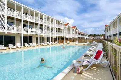 Image de Duplex dans une résidence sécurisée avec piscine pour 8 à 10 personnes à Mimizan plage