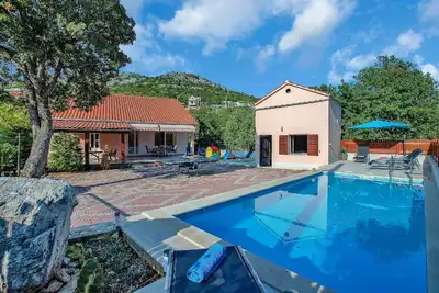 Image de Maison de vacances Zagvozd pour 1 - 8 personnes avec 4 chambres à coucher - Maison mitoyenne