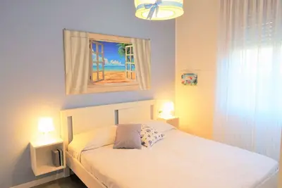 Image de Appartement de vacances au rez-de-chaussée avec jardin et piscine commune