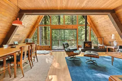 Image de Riverside A-frame in gated cabin community with private deck, woodstove, & W\/D