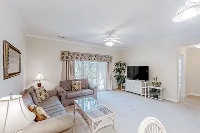Image de Lake-view ground-floor condo with screened patio, W/D, & pool
