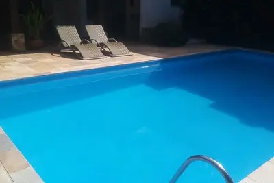 Image de Casa Praiana, 300 Metros da Praia, com Piscina e Churrasqueira