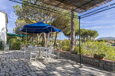 Image de Gaia in Marina di Campo, with outdoor space, in a quiet area, with air conditioning and private park
