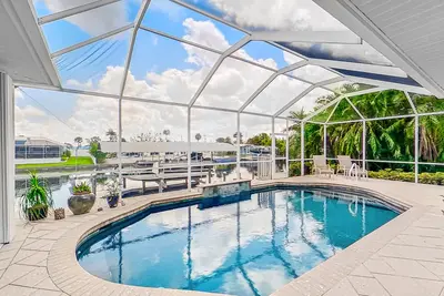 Image de Dog-friendly waterfront home with heated pool, lanai, central Ac, & W/D