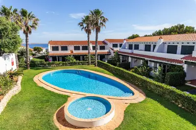 Image de Maison de vacances \"Maison Menorca\" avec vue sur la mer, piscine partagée et Wi-Fi