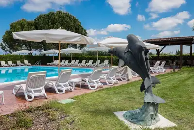 Image de Joli appartement pour 7 personnes avec Wifi, piscine, climatisation, Tv, patio et parking