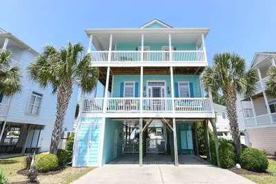 Image de 5 Br Beach House with a Private Pool in Garden City! - A Nautical Blue Inn