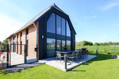 Image de Un nid dans la Grange - Maison avec jacuzzi et sauna