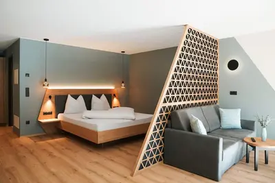 Image de Studio 'Garden Lodge Exclusive Two' avec vue montagne, terrasse privée et Wi-Fi