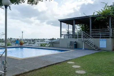 Spacious townhouse with scenic view, swimming pool located in a gated community.