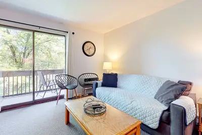 2nd-floor condo with a private balcony, on-site beach, outdoor pool, laundry