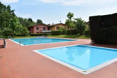 Image de Renovierte Wohnung\/ Pool\/ Tv\/ Wlan\/ Garage\/ Familiy Friendly