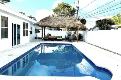 Heated pool home with Tiki Hut.