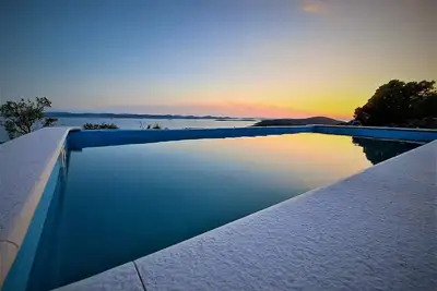 Image de Romantic isolated villa with pool surrounded by pure nature.