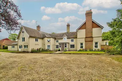 A house  that sleeps 28 guests  in 9 bedrooms