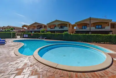 Image de Appartement de vacances 'Casa Vacanze Mandorlo' avec piscine partagée, terrasse et jardin