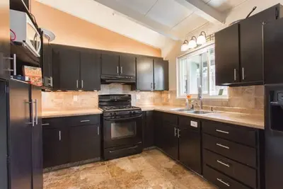 Image de Monterey craftsman style home with vaulted exposed-beams ceiling hardwood floor
