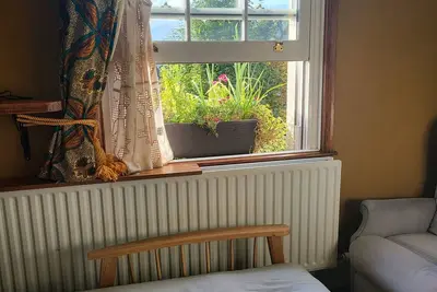 Charming Victorian Room. Futon and laptop table. Close to all amenities.
