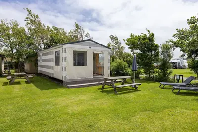Image de Joli chalet avec WiFi, à seulement 1 km. de la plage
