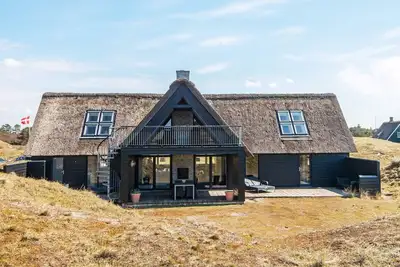 Image de Maison de vacances pour 8 a Fanø-By Traum