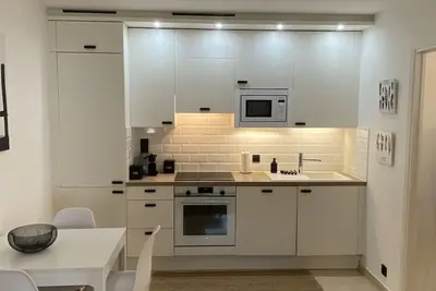 Image de F2 en rez de jardin avec terrasse et parking