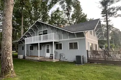 Image de Torch Lake home, south end of lake, sandy beach, mile-and-a-half from sand bar!